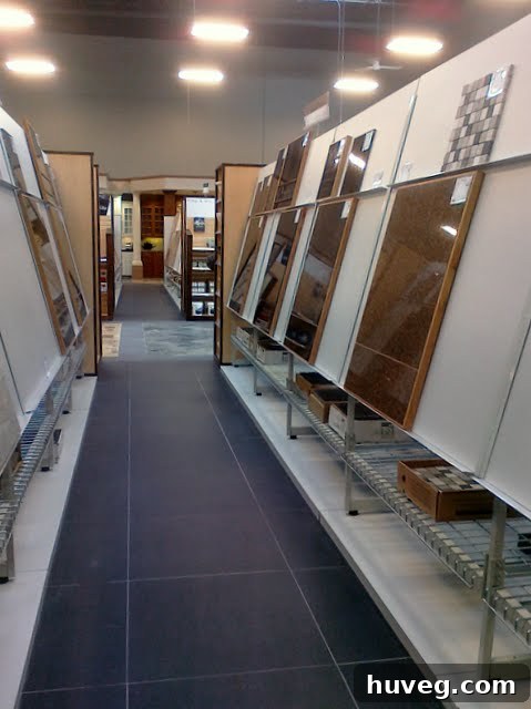 Close-up of a tile display showing various neutral-toned tiles
