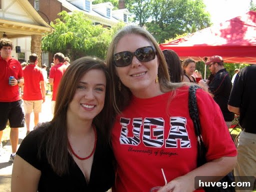 The author and Brooke, who recently got engaged, smiling happily together at a college gameday.