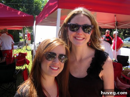 The author and Erin smiling for a photo during a fun college football gameday.