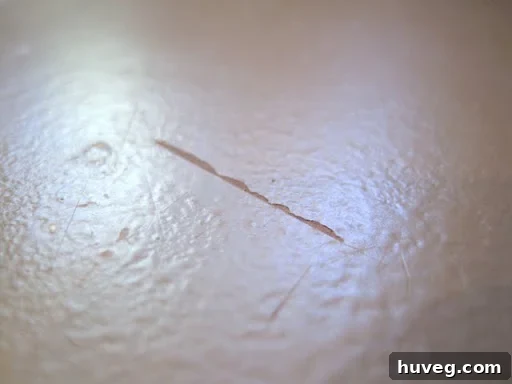 Close-up of scratch marks on painted kitchen countertops