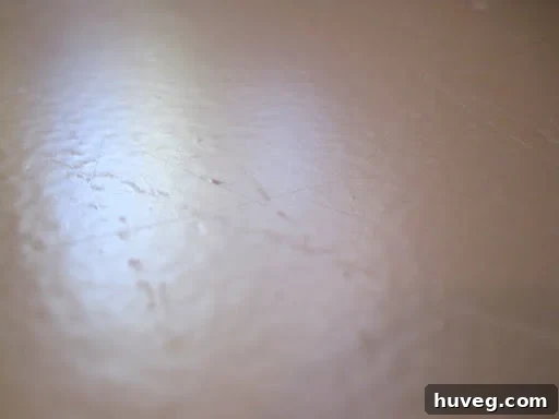 Another view of damage to painted countertops after being scratched