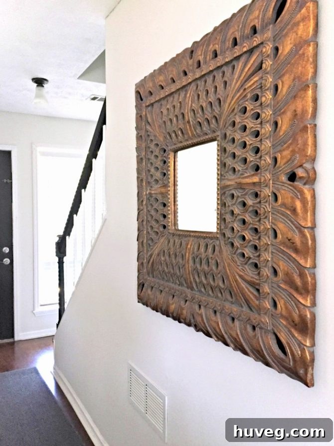 Stunning oversized peacock mirror as a new hallway focal point