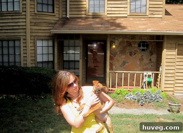 Another candid shot of the author and Charlie, capturing various expressions and the puppy's lively nature.