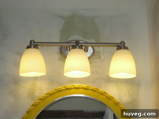 A sleek, modern, and energy-efficient new bathroom light fixture, illuminating the space with clear, bright light.