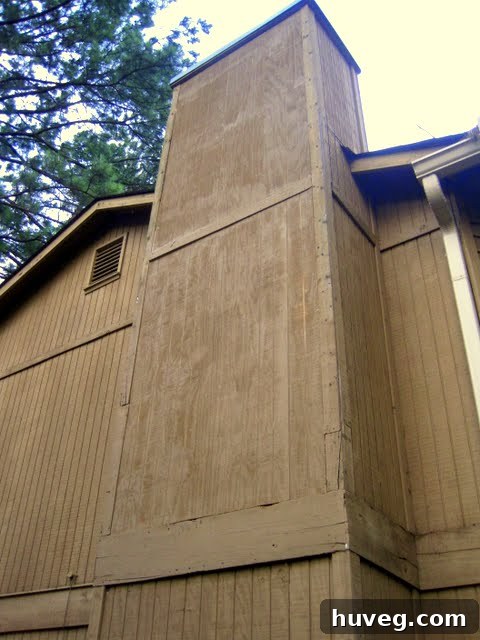Exterior view of a window frame being prepared for painting or repair, emphasizing precise craftsmanship