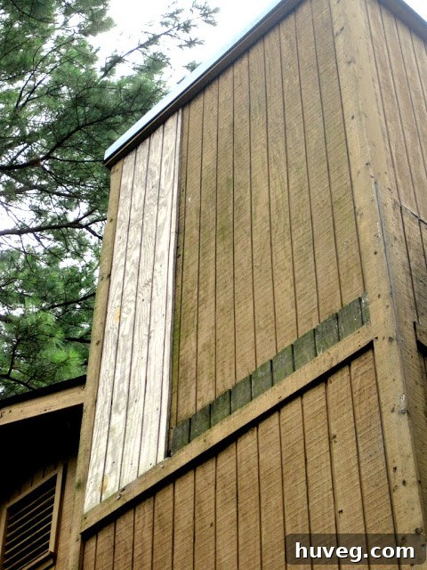 A close-up of the upper chimney area with visible signs of amateur repair work, including mismatched patching and deteriorated materials that have failed over time.