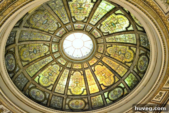 A breathtaking stained glass ceiling, illuminating the space with vibrant colors and intricate patterns.