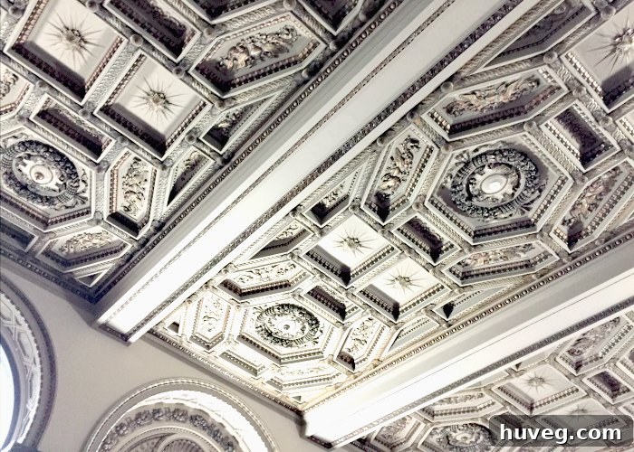 Detailed view of ornate ceiling decorations and architectural patterns inside a historic building in Chicago.