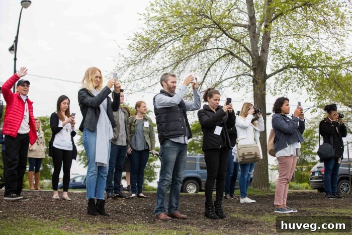 A group of bloggers actively taking photos of the Chicago skyline and waterfront, showcasing their dedication to capturing inspiring content.