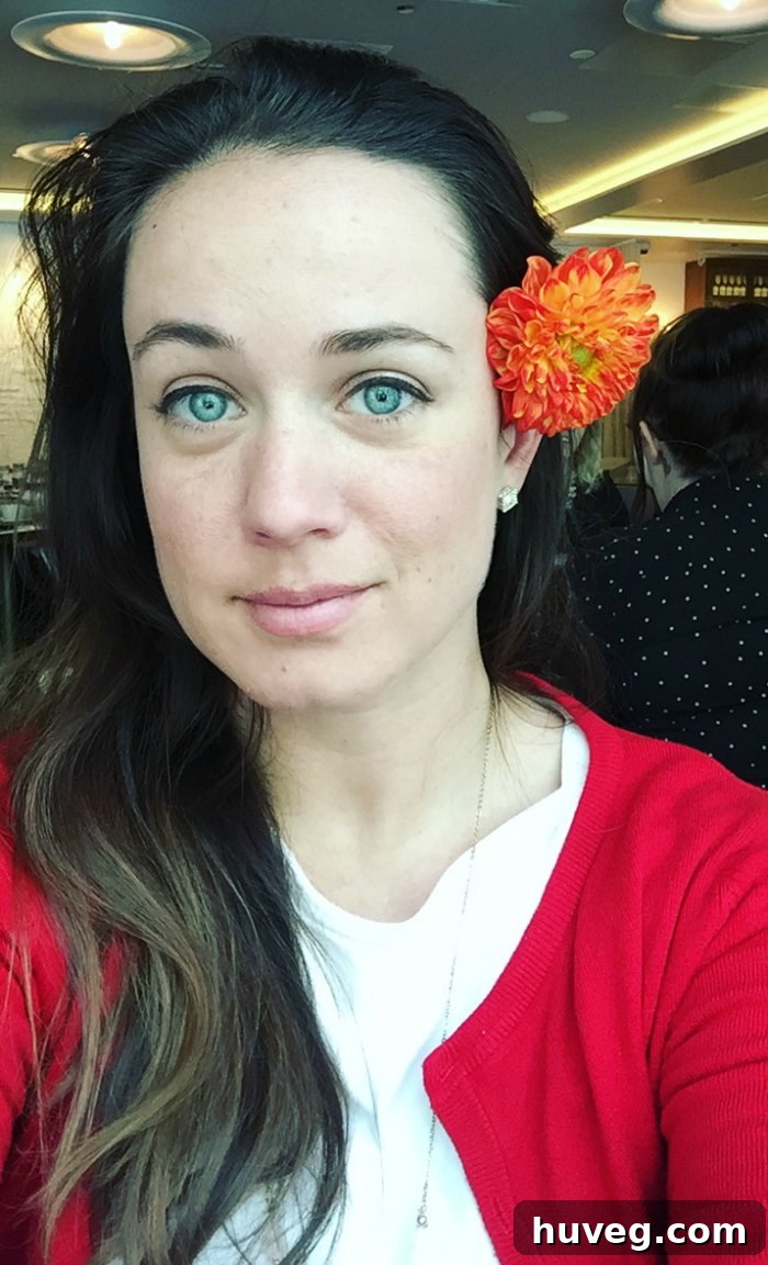 A selfie with a striking floral arrangement in a stylish setting, adding a personal touch to the travel experience.