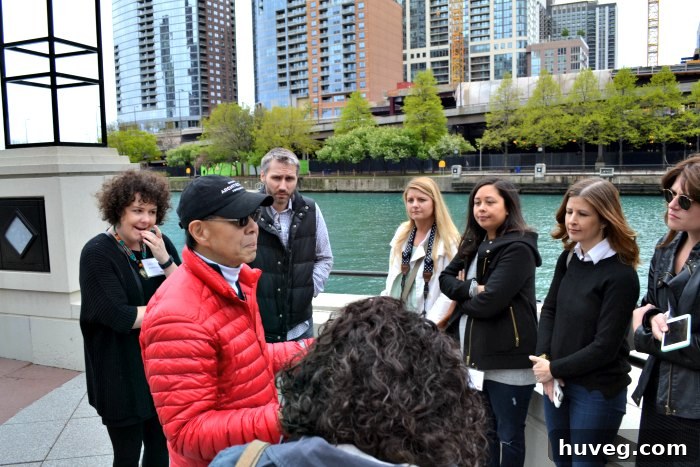 A group of design bloggers exploring Chicago on a combination walking and trolley tour, capturing architectural details.