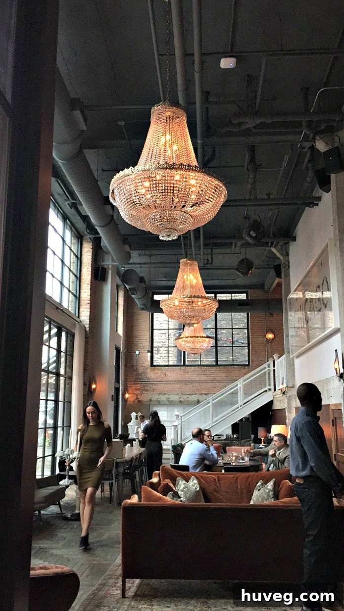 Dinner scene with Delta Faucet at the exclusive Soho House in Chicago, featuring an elegant dining setting and warm lighting.