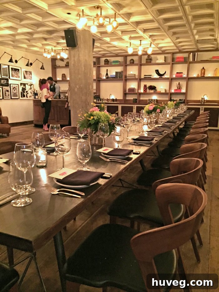 The stylish upstairs area of Soho House in Chicago, featuring comfortable seating, modern decor, and a sophisticated ambiance.