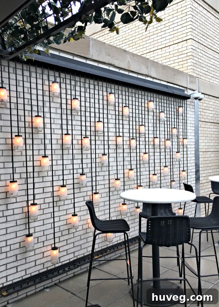 The LondonHouse Chicago rooftop terrace, elegantly furnished with modern seating and an open, inviting atmosphere, despite a slightly overcast sky.