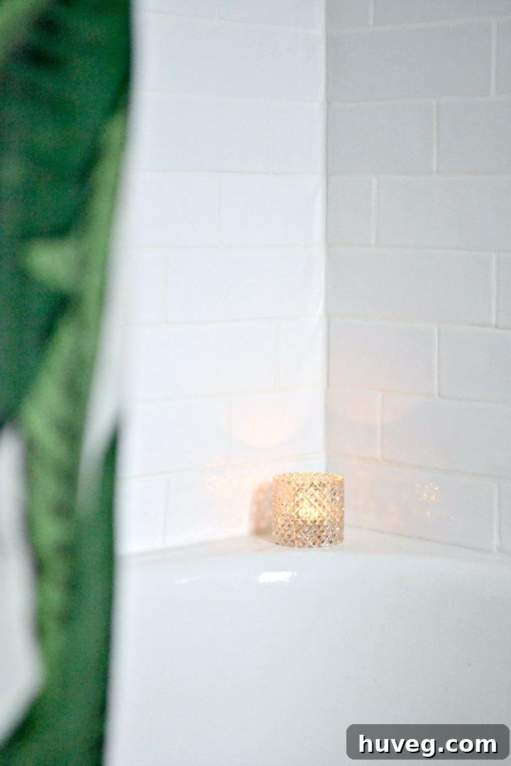 Close-up views of the white shower makeover in the master bathroom, highlighting meticulous details