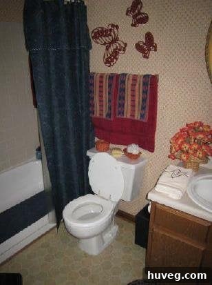 Original listing photo of the master bathroom before renovation, highlighting the dramatic transformation