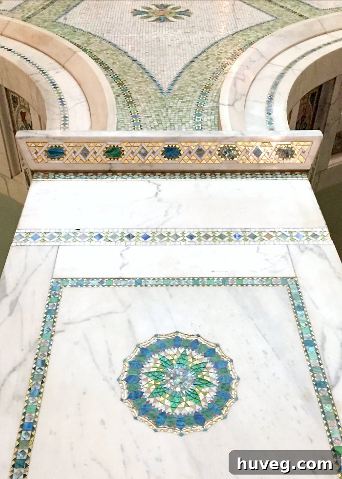 Exquisite tile and glass inlay in marble from a historic Chicago building, showcasing intricate craftsmanship
