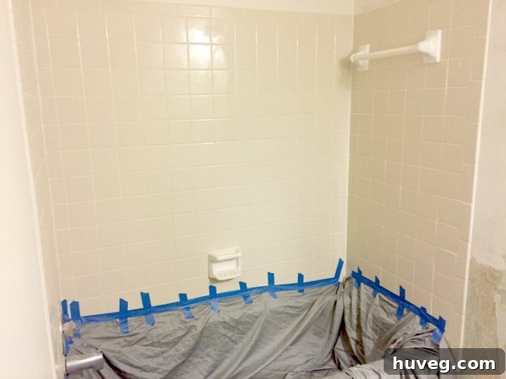 Before shot of the old master bathroom shower, showing its dated appearance before renovation