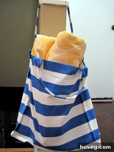 A stylish, blue IKEA shopping bag, perfect for a beach trip, featuring a playful design.
