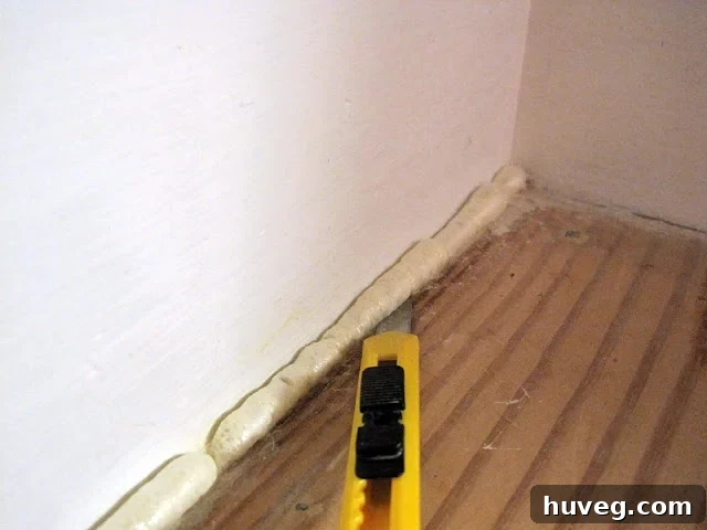 Trimmed and prepared stair gap with GREAT STUFF foam