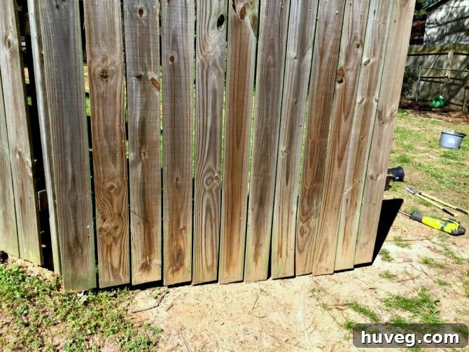 Fence - gate touches the ground leading to warping and frequent replacing of pickets