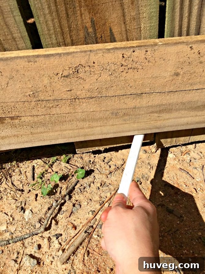 use carpenters pencil to mark pickets along gate