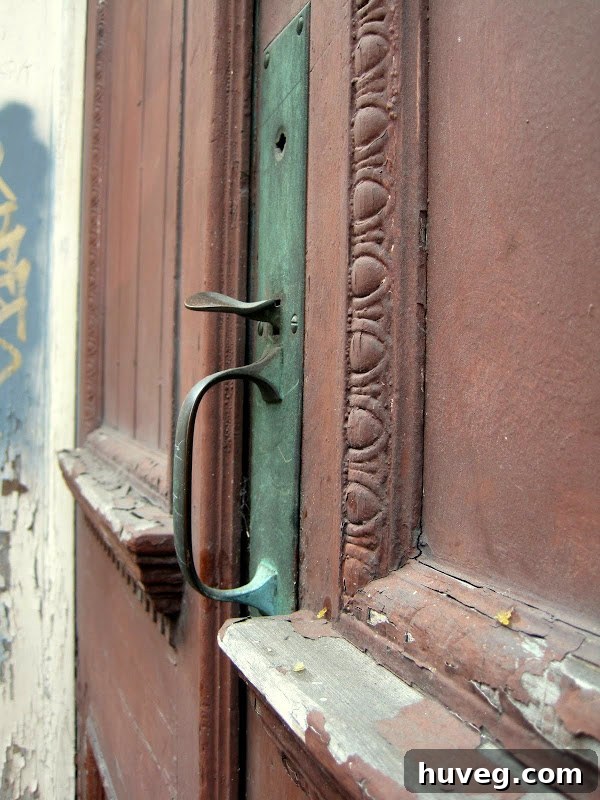 New Orleans - old rusted door locks and red trim