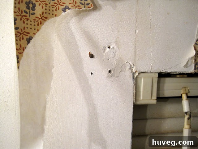 Rusty nails used to hang window treatments, an example of previous owner shortcuts
