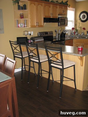 Another 'before' view of the kitchen cabinets, highlighting the dated appearance