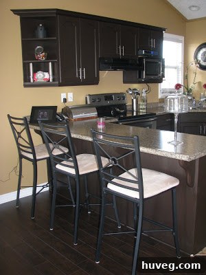 Close-up 'after' picture of the kitchen cabinets with elegant new hardware