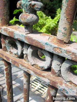Patterned texture of a dark, weathered stone wall or paving in New Orleans, showing natural variations and rugged beauty suitable for an earthy home decor theme.