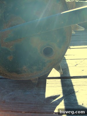 Tow-behind aerator being filled with water to add weight