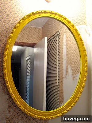 Another view of the yellow mirror frame, highlighting its impact on the bathroom decor.