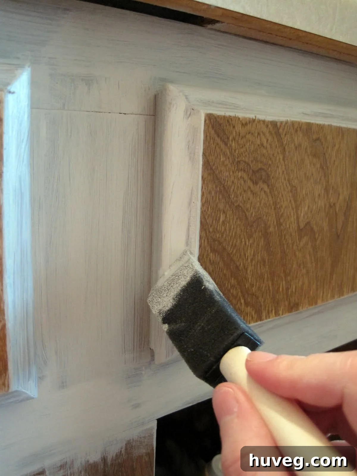 Paint the cabinet sides and drawers carefully for even coverage.