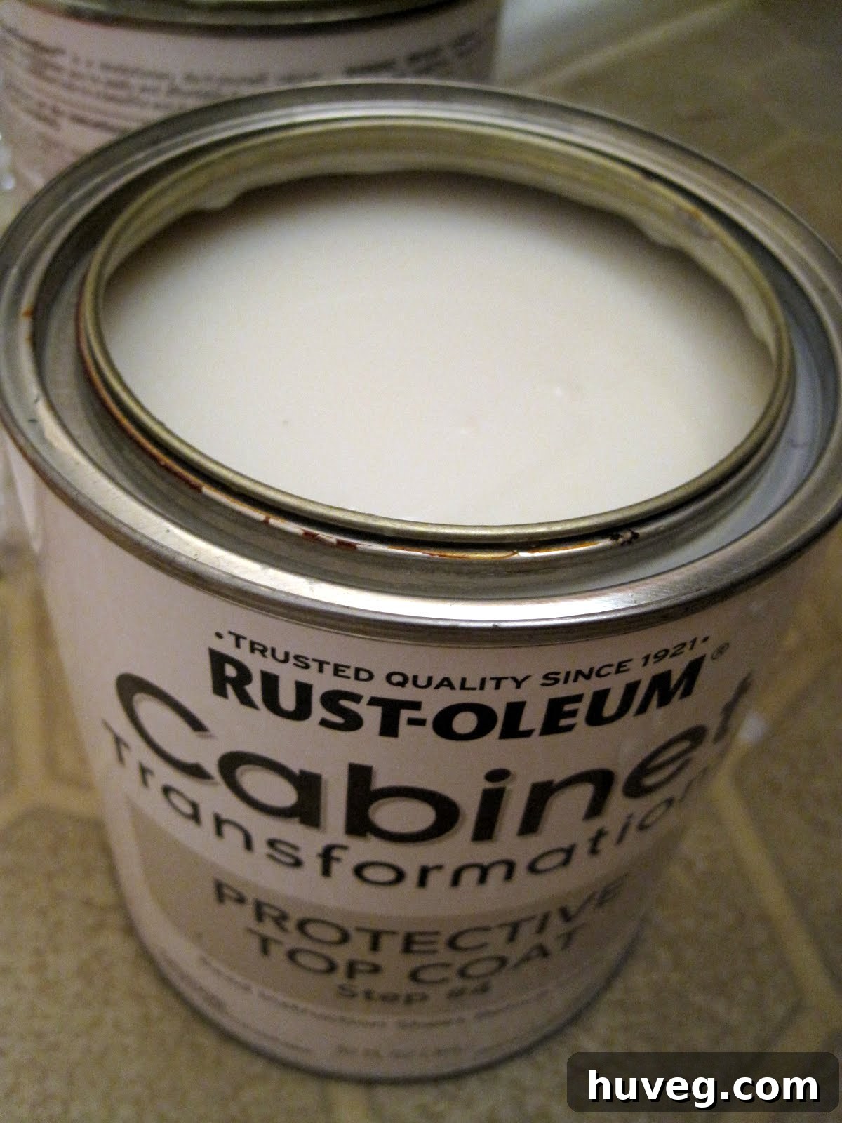 Applying the milky top coat provides protection and a satin finish.