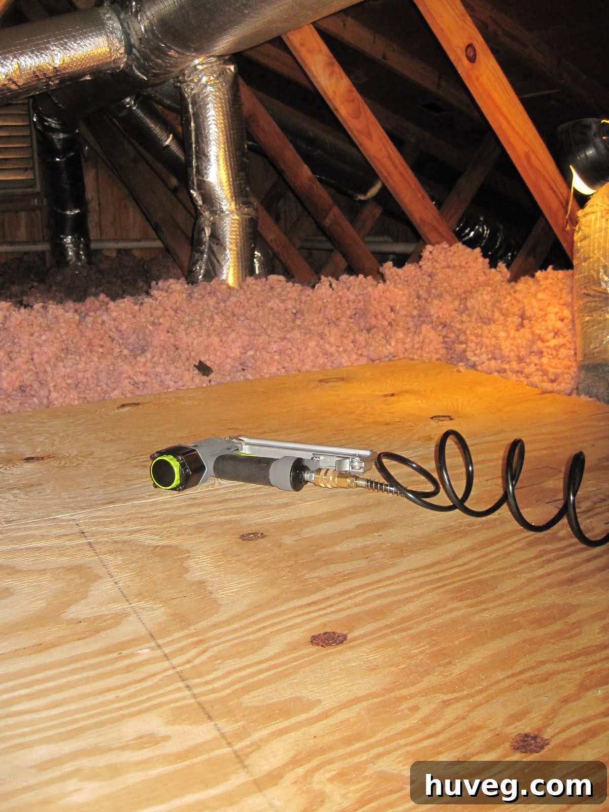 Plywood pieces being laid in the attic