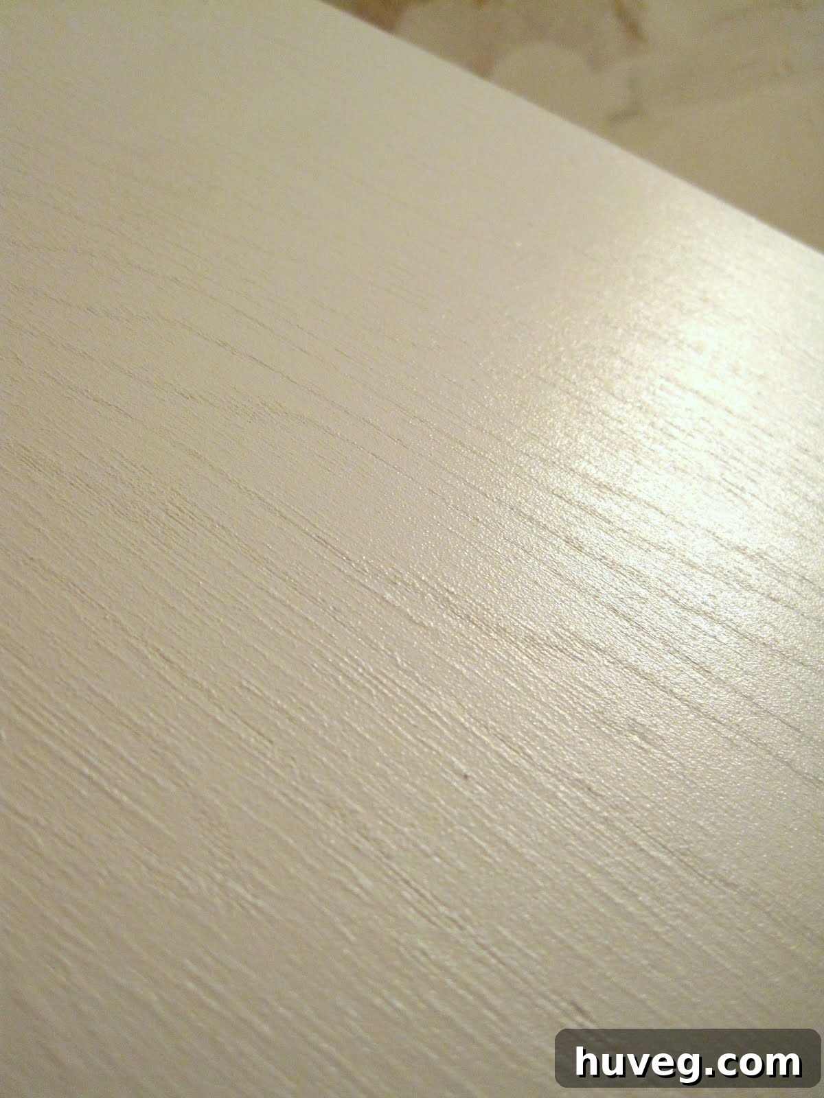 Angle view of refreshed bathroom cabinet with satin finish