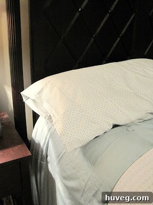Close-up of vibrant blue patterned bedsheets, signaling a fresh start for spring.