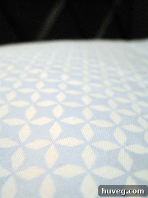 Another view of the cheerful blue bedsheets, showcasing the intricate pattern.