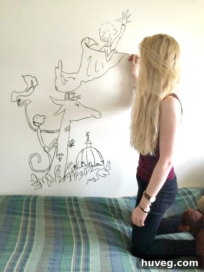 Ruth Stolerman meticulously painting a detailed mural for a children's bedroom, demonstrating her artistic process and focus.