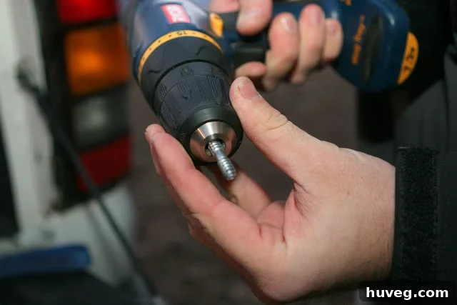 Attaching dowel screw to wooden leg with a drill