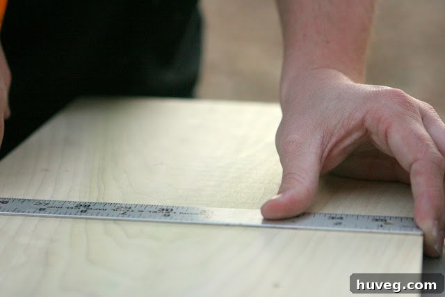 Measuring the center point for dog bowl placement on wood