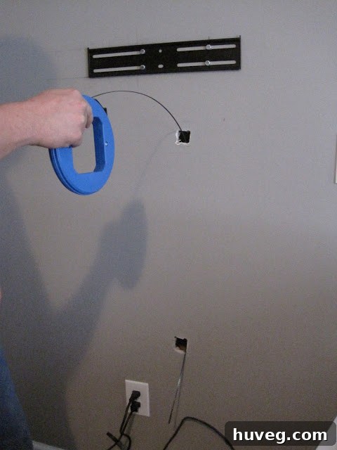 Wire emerging from top and bottom holes after using fish tape