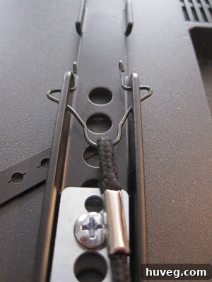 Strings that lock and unlock the TV hooks on the wall mount