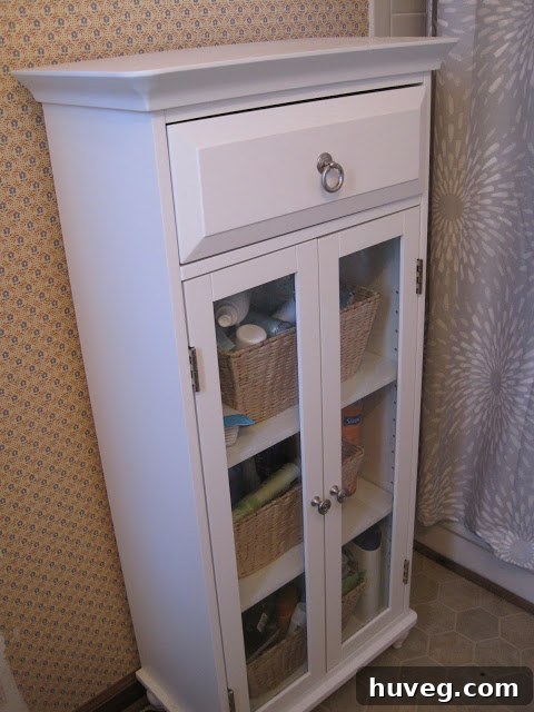 Interior of the tiny storage cabinet, filled with various bath products.