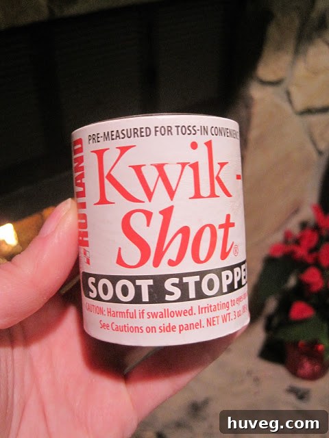 A soot cleaner stick, ready to be thrown into the fire.