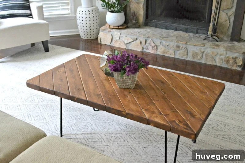 Completed DIY hairpin leg coffee table in a modern living room setting, showcasing its functional and aesthetic appeal.