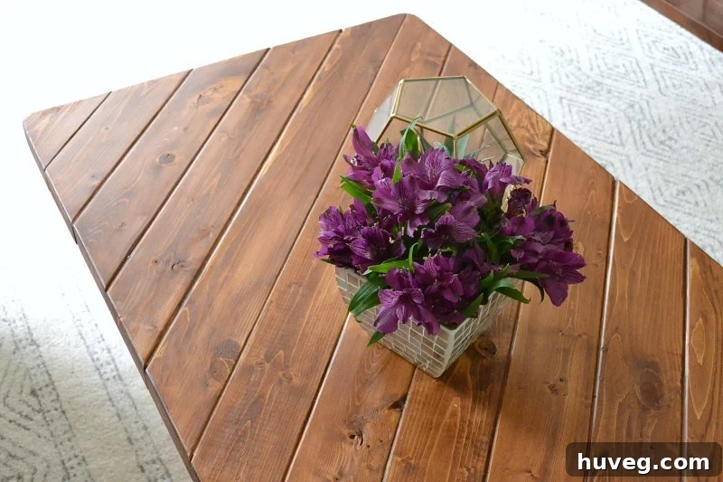 Close-up of the hairpin leg coffee table crafted from 2x4 lumber, highlighting the wood grain and design.