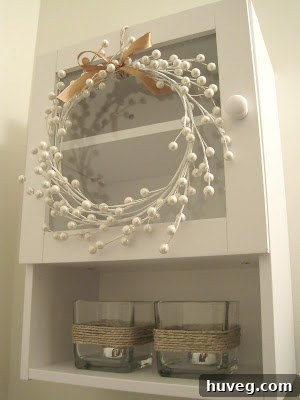 Handmade $4 berry wreath hanging in a room