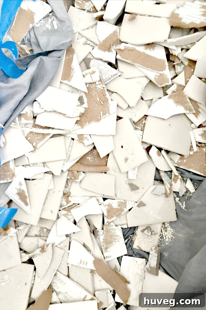 lots of broken tiles in the tub